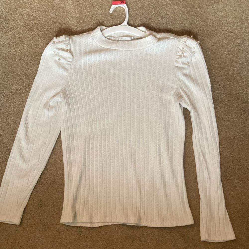 White ribbed fitted blouse with mock neck and puff sleeves